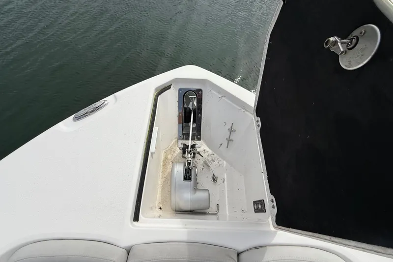 Slide: The Image of 2021 Sea Fox 288 Commander boat anchor compartment, open on calm water. - 40