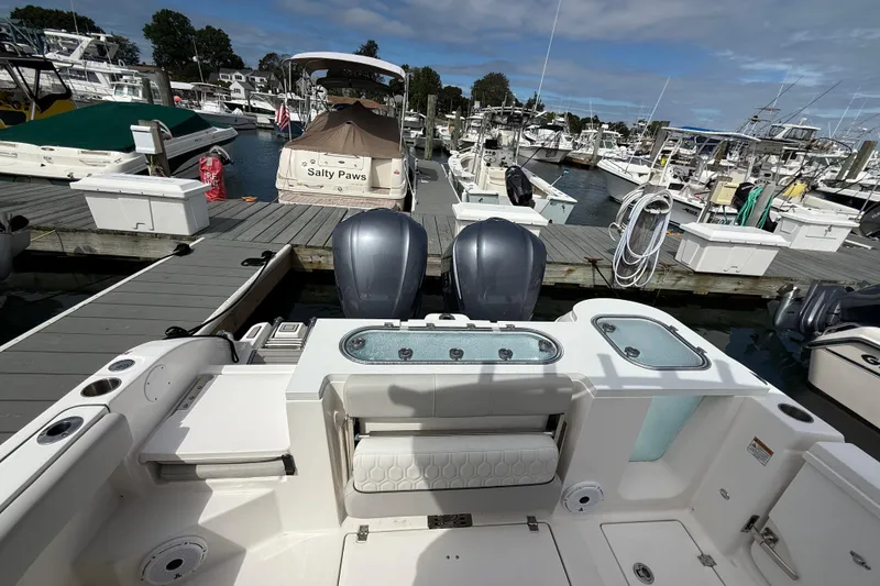 Slide: The Image of 2021 Sea Fox 288 Commander boat docked at marina with dual engines. - 6