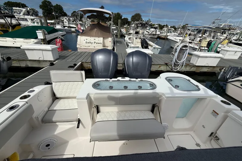 Slide: The Image of 2021 Sea Fox 288 Commander boat docked at marina with twin engines. - 7