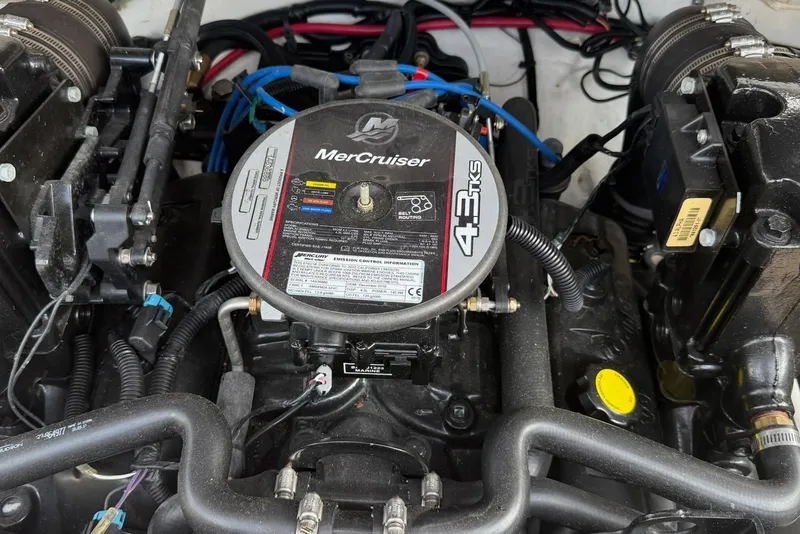 Slide: The Image of MerCruiser 4.3L engine in a 2012 195 SS boat, detailed view of components. - 14