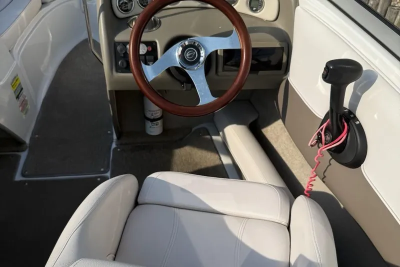 Slide: The Image of Interior of a 2012 195 SS boat with steering wheel and controls. - 5