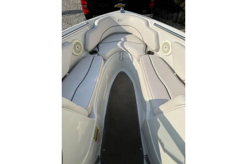 Slide: The Image of Interior view of a 2012 195 SS boat with white seating and speakers. - 7