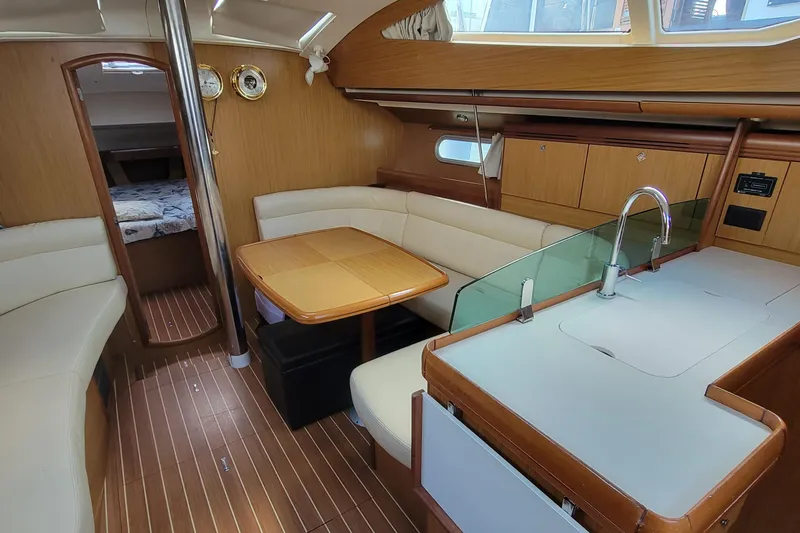 Slide: The Image of Interior of 2008 Jeanneau Sun Odyssey 42 DS sailboat with modern wood finish. - 1