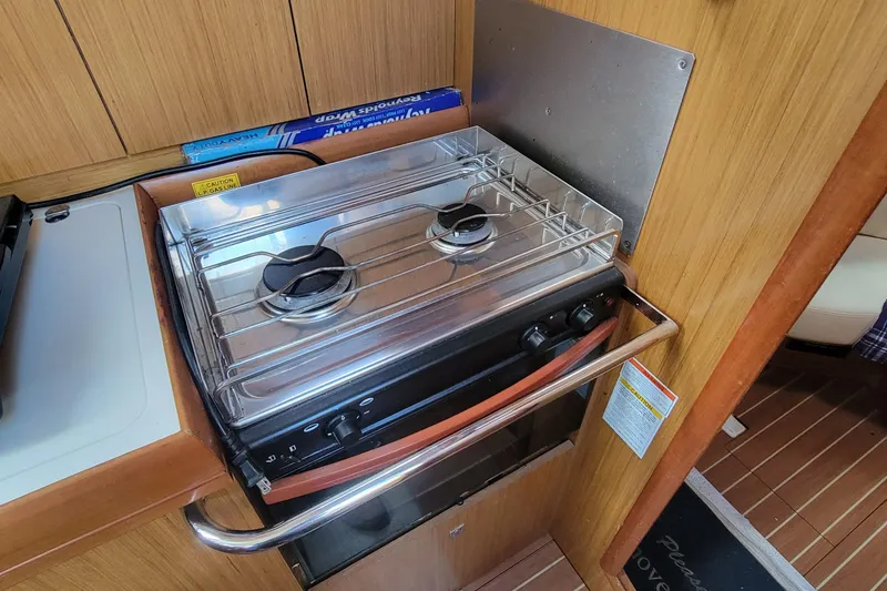 Slide: The Image of Compact kitchen stove in 2008 Jeanneau Sun Odyssey 42 DS yacht interior. - 14