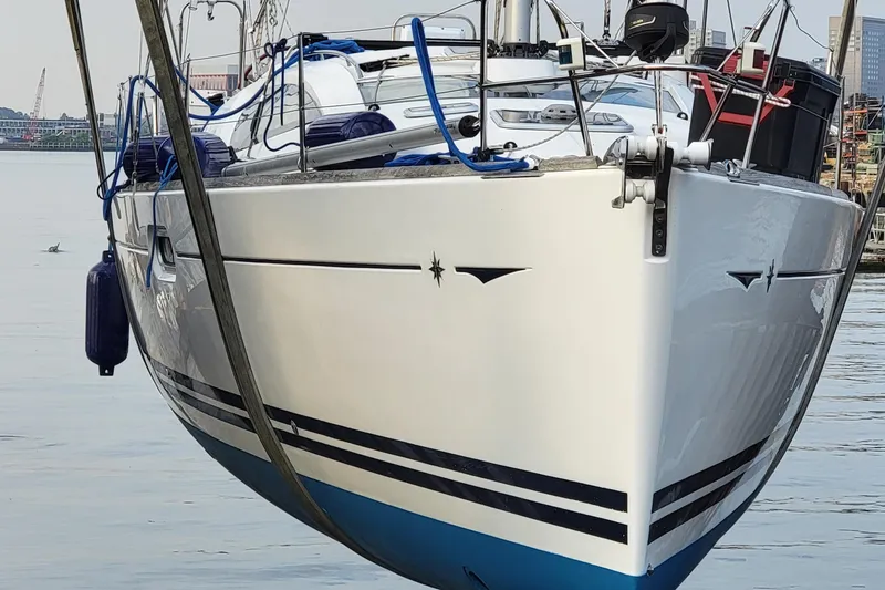 Slide: The Image of 2008 Jeanneau Sun Odyssey 42 DS sailboat docked, showcasing sleek design and nautical elegance. - 18