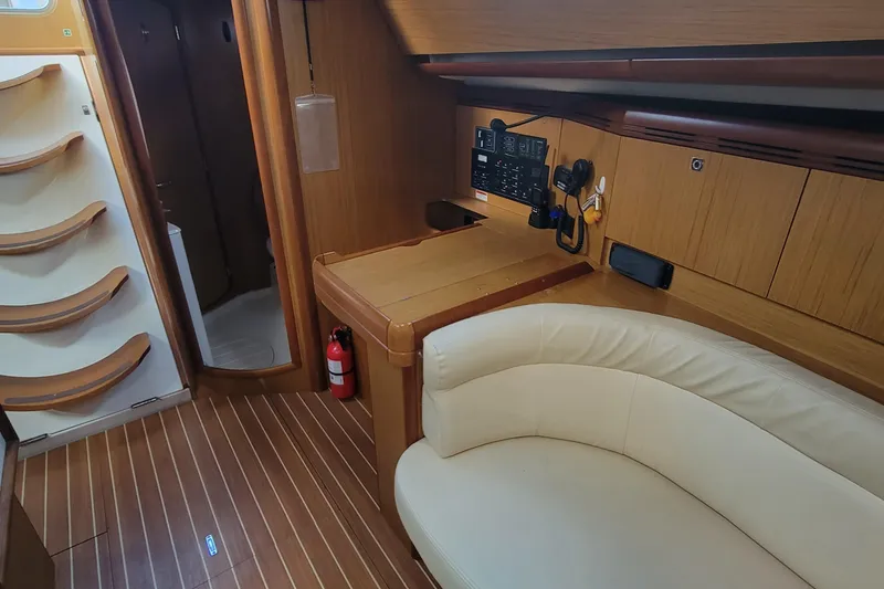 Slide: The Image of Interior of 2008 Jeanneau Sun Odyssey 42 DS yacht with wood finish and seating area. - 5