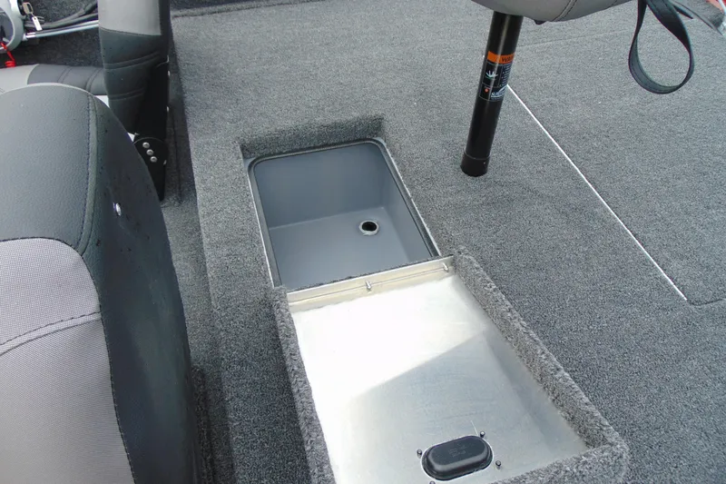Slide: The Image of 2026 Crestliner 1700 Storm boat interior with open storage compartment. - 12