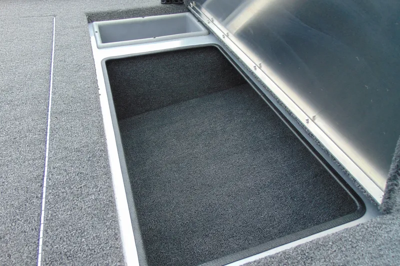 Slide: The Image of 2026 Crestliner 1700 Storm boat storage compartment with open lid, showcasing spacious interior. - 7