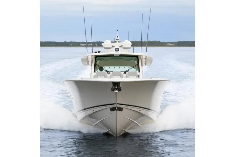 Slide: The Image of Manufacturer Provided Image: 2025 Scout 530 LXF boat cruising on open water. - 5
