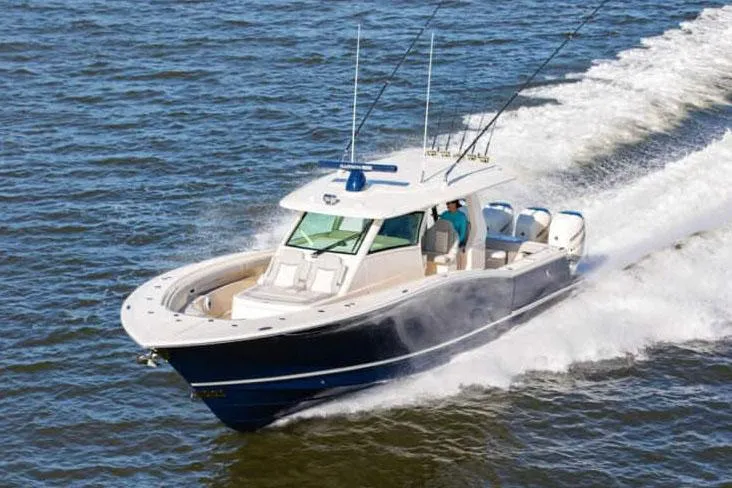 The Image of Manufacturer Provided Image: 2025 Scout 425 LXF boat cruising on open water, showcasing sleek design and performance. - 0