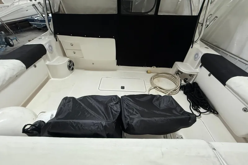 Slide: The Image of 2006 Tiara Yachts 3800 Open interior with seating, storage, and marine equipment. - 13