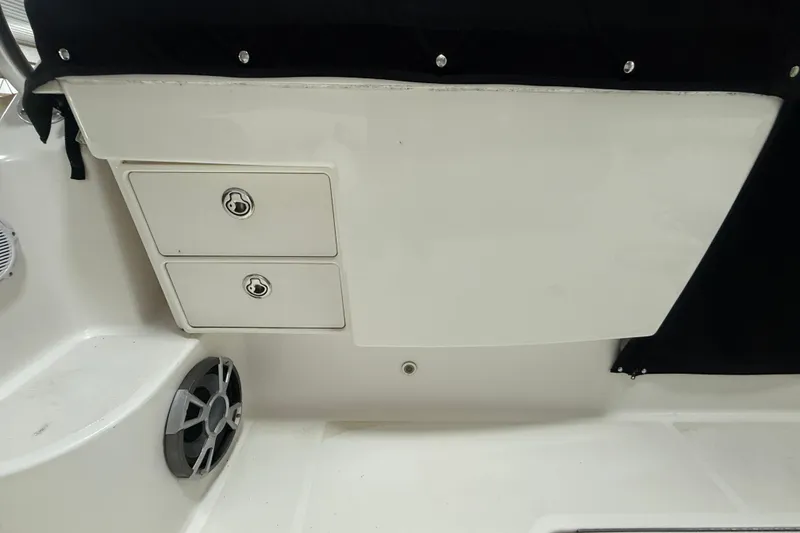 Slide: The Image of 2006 Tiara Yachts 3800 Open interior storage compartments and speaker detail. - 16