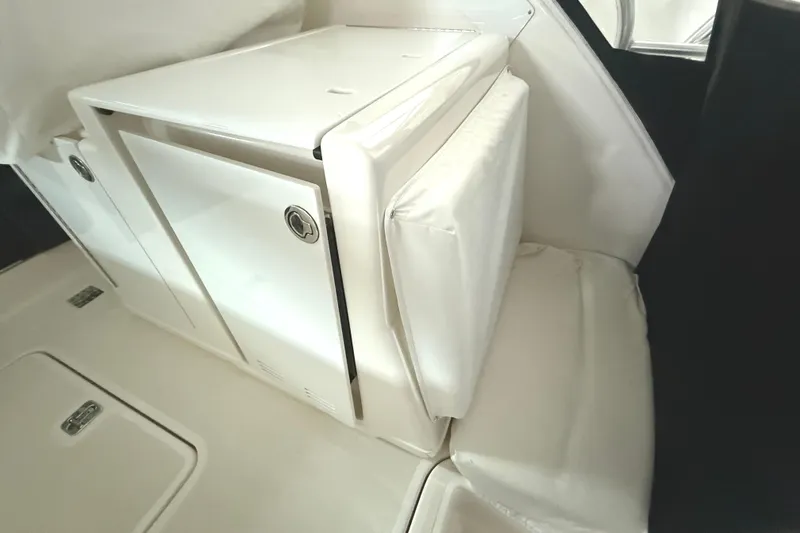 Slide: The Image of 2006 Tiara Yachts 3800 Open interior with white cabinetry and seating. - 18