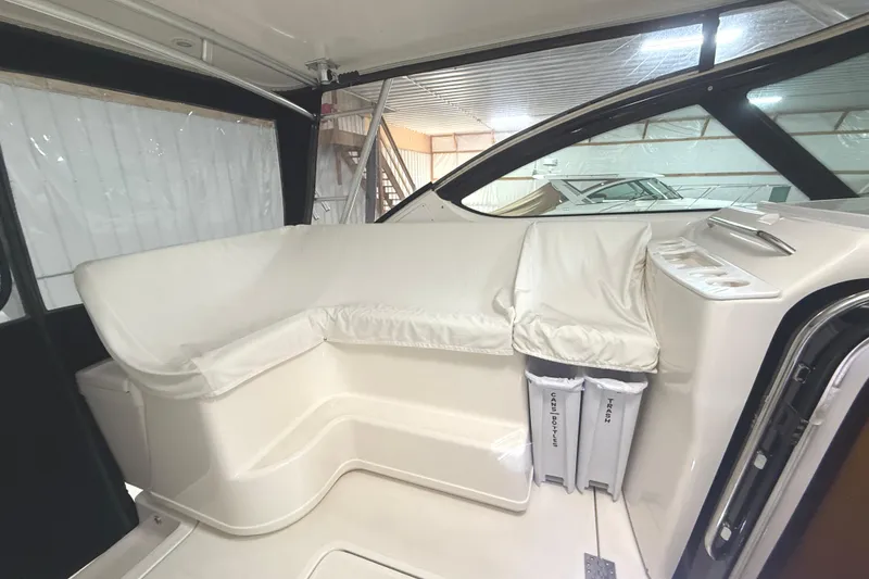 Slide: The Image of 2006 Tiara Yachts 3800 Open interior with white seating and cup holders. - 20