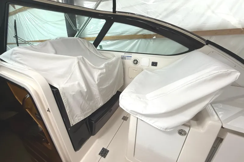 Slide: The Image of 2006 Tiara Yachts 3800 Open interior with covered seats and dashboard. - 21