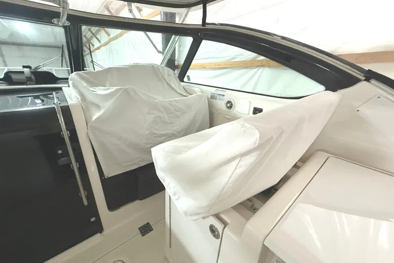 Slide: The Image of 2006 Tiara Yachts 3800 Open interior with covered seats and helm station. - 22