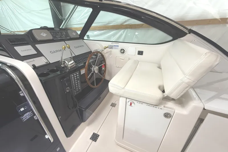 Slide: The Image of 2006 Tiara Yachts 3800 Open helm with Garmin navigation and white seating. - 23