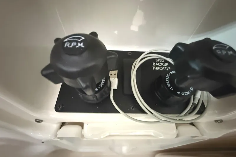 Slide: The Image of Close-up of 2006 Tiara Yachts 3800 Open throttle controls with RPM indicators. - 26