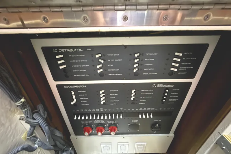 Slide: The Image of Electrical control panel on a 2006 Tiara Yachts 3800 Open, featuring AC and DC distribution. - 27