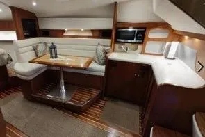 Slide: The Image of 2006 Tiara Yachts 3800 Open interior with elegant seating and dining area. - 29