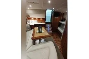 Slide: The Image of 2006 Tiara Yachts 3800 Open interior with cozy seating and elegant wood finishes. - 32