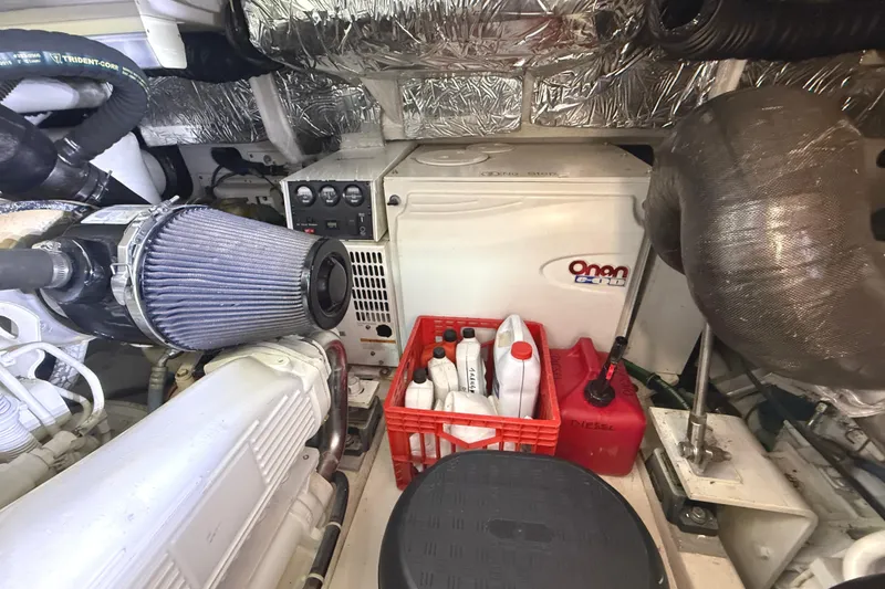 Slide: The Image of Engine room of 2006 Tiara Yachts 3800 Open with Onan generator and maintenance supplies. - 40