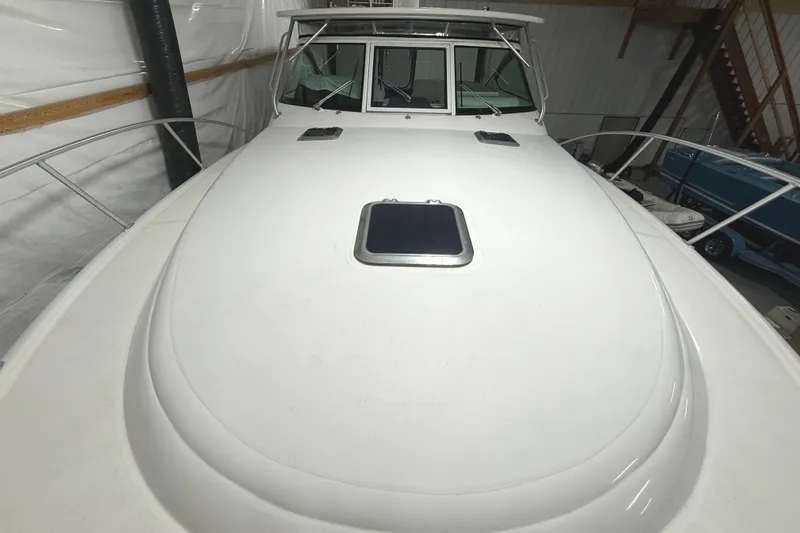 Slide: The Image of 2006 Tiara Yachts 3800 Open boat deck in storage, showcasing sleek design and spacious layout. - 6