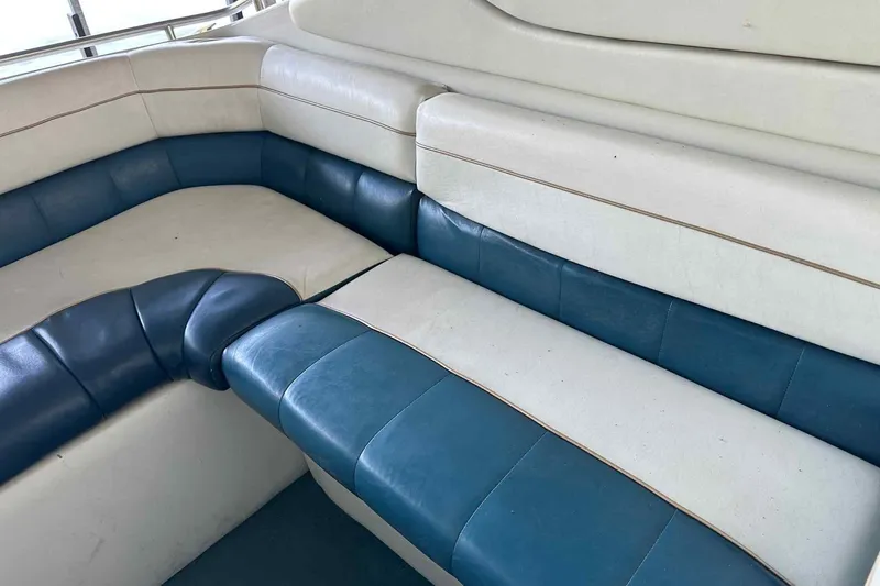 Slide: The Image of Blue and white seating on 1995 Genesis Boats 2505, showcasing comfortable interior design. - 23