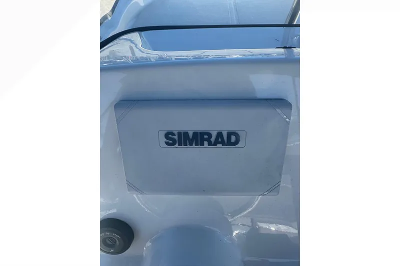 Slide: The Image of 2023 Boston Whaler 150 Montauk featuring Simrad marine electronics. - 16