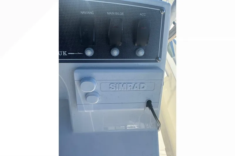Slide: The Image of Control panel of 2023 Boston Whaler 150 Montauk with Simrad electronics. - 18