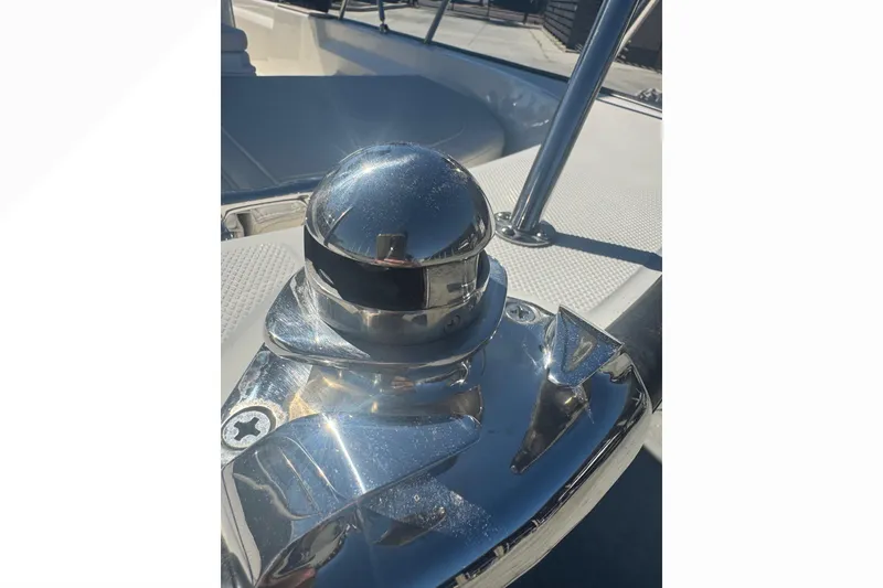 Slide: The Image of 2023 Boston Whaler 150 Montauk boat detail with shiny chrome hardware. - 19