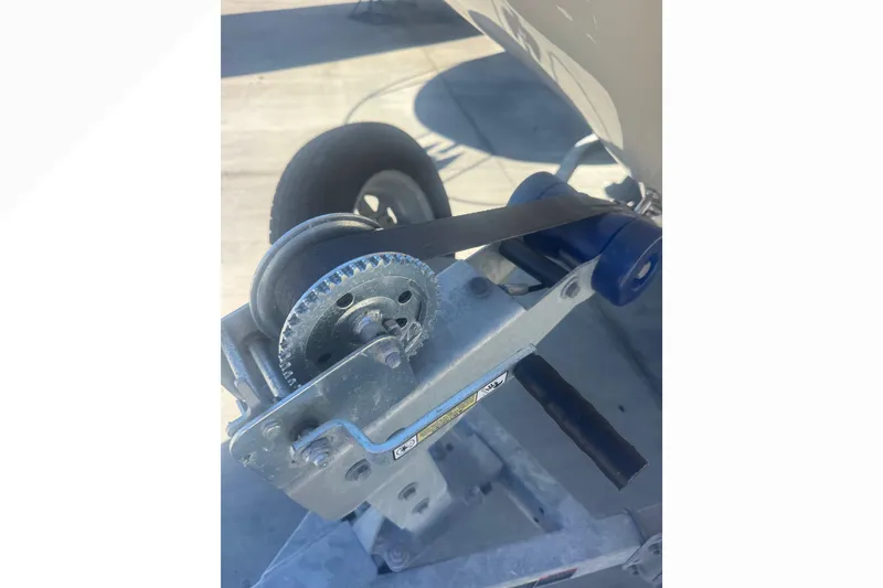 Slide: The Image of Winch mechanism on a 2023 Boston Whaler 150 Montauk boat trailer. - 25