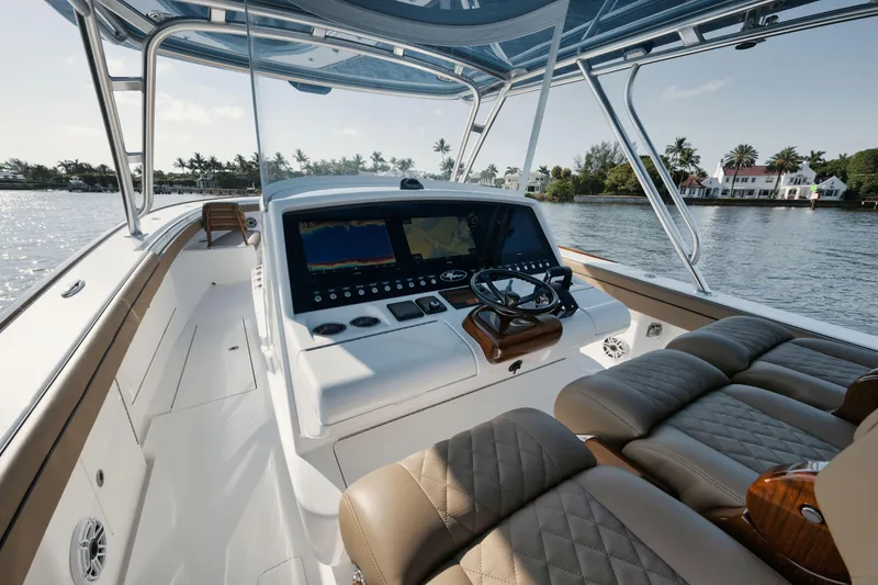Slide: The Image of 2023 Valhalla Boatworks V-41 helm with luxurious seating and advanced navigation system. - 11