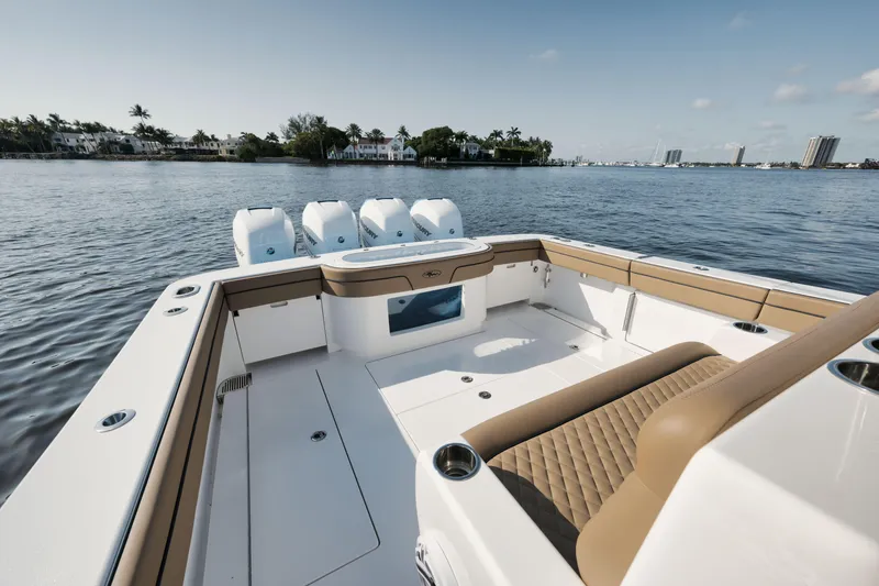 Slide: The Image of 2023 Valhalla Boatworks V-41 on calm water, showcasing luxurious seating and powerful engines. - 20