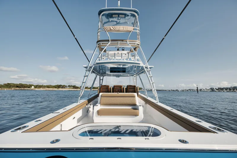 Slide: The Image of 2023 Valhalla Boatworks V-41 on water, showcasing sleek design and spacious deck. - 21