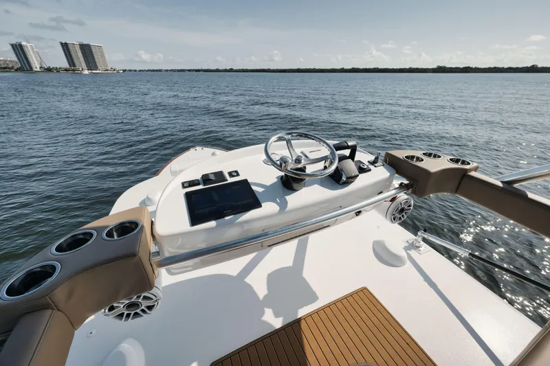 Slide: The Image of 2023 Valhalla Boatworks V-41 helm with modern controls on open water. - 24