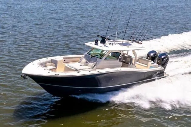 The Image of Manufacturer Provided Image: 2025 Scout 400 LXF boat cruising on open water. - 0