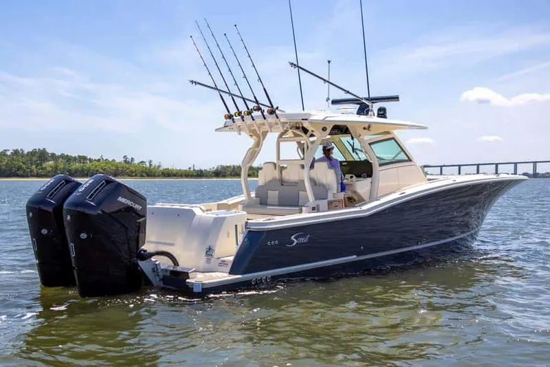 Slide: The Image of Manufacturer Provided Image: 2025 Scout 400 LXF boat with dual engines on calm water. - 3