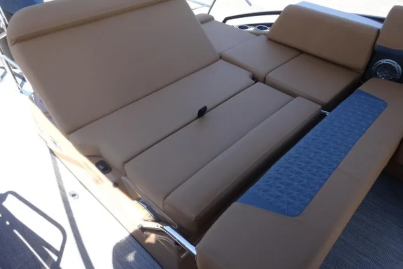 Slide: The Image of 2026 Harris Solstice 250 boat with luxurious tan seating and blue accents. - 11