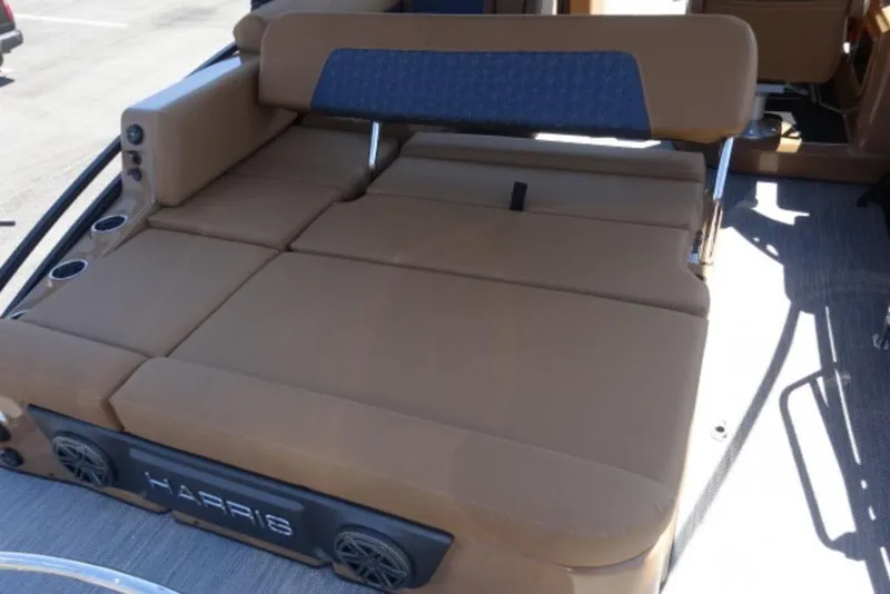 Slide: The Image of 2026 Harris Solstice 250 boat interior with tan seating and cup holders. - 13