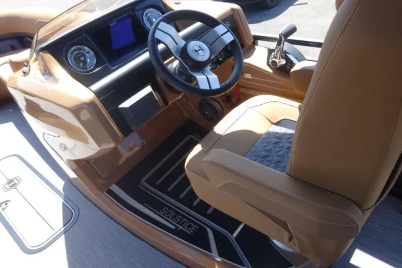 Slide: The Image of 2026 Harris Solstice 250 boat interior with steering wheel and captain's seat. - 4