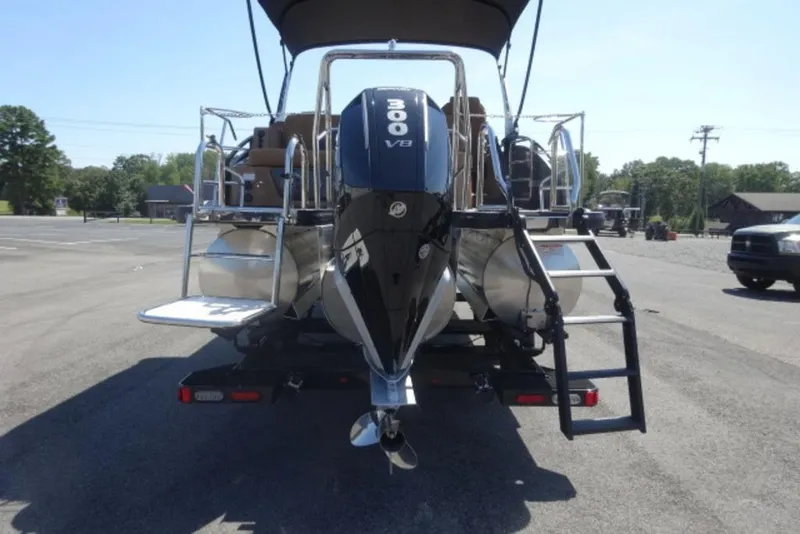 Slide: The Image of 2026 Harris Solstice 250 pontoon boat with powerful 300 V8 engine, parked outdoors. - 8
