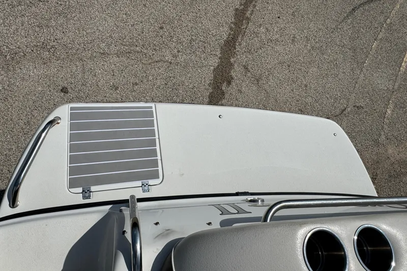 Slide: The Image of 2003 Crownline 262 CR boat deck with metal railings and textured surface. - 22