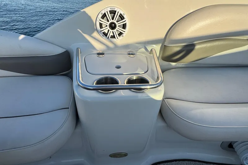 Slide: The Image of 2003 Crownline 262 CR boat interior with cup holders and speaker. - 37