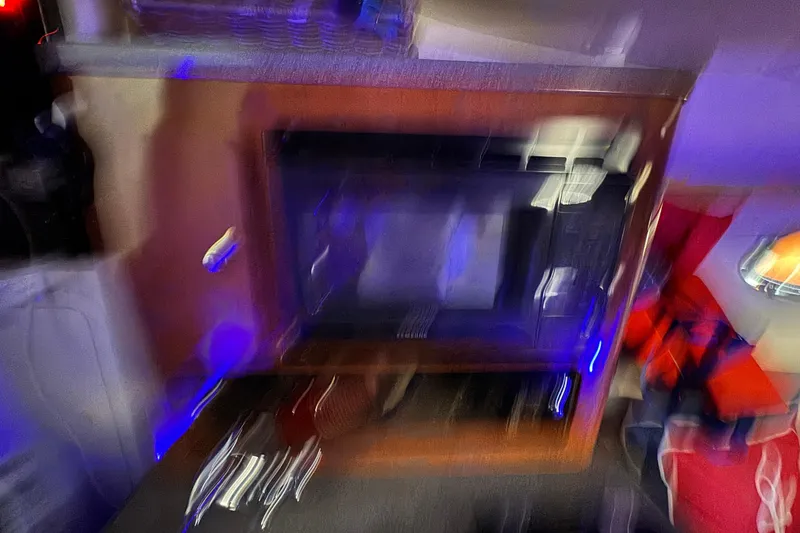 Slide: The Image of Blurry interior of a 2003 Crownline 262 CR boat with vibrant colors. - 44