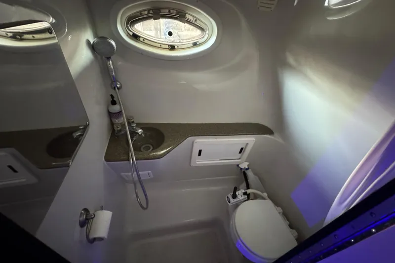 Slide: The Image of 2003 Crownline 262 CR boat bathroom with sink, shower, and toilet. - 47