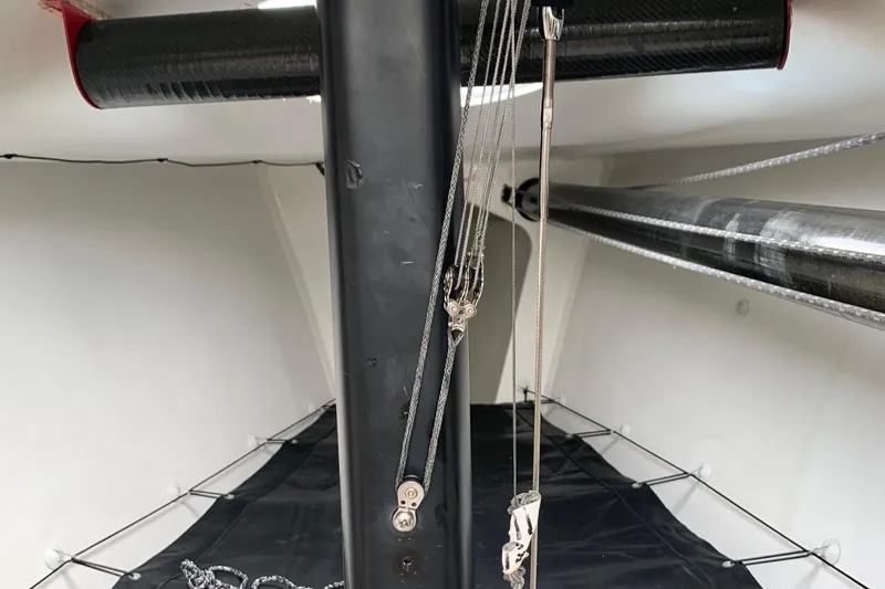 Slide: The Image of Interior view of a 2010 Melges 32 sailboat, featuring rigging and carbon fiber components. - 3