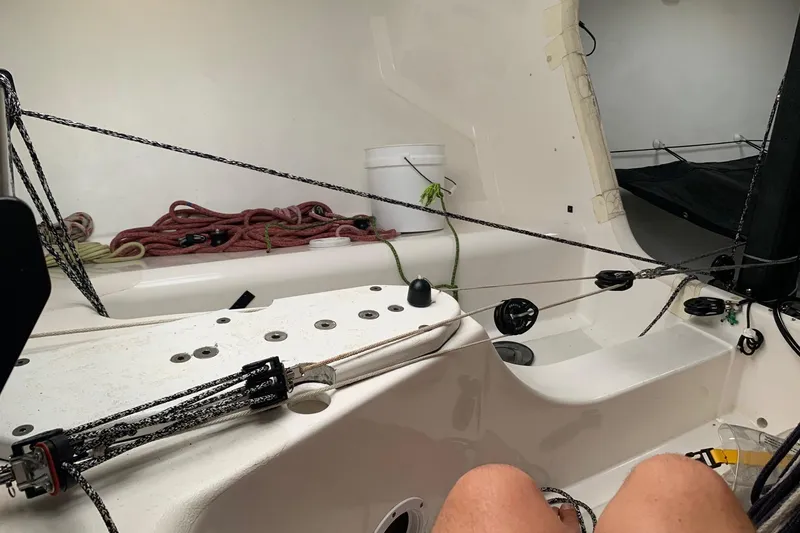 Slide: The Image of Interior of a 2010 Melges 32 sailboat, featuring ropes and sailing equipment. - 4