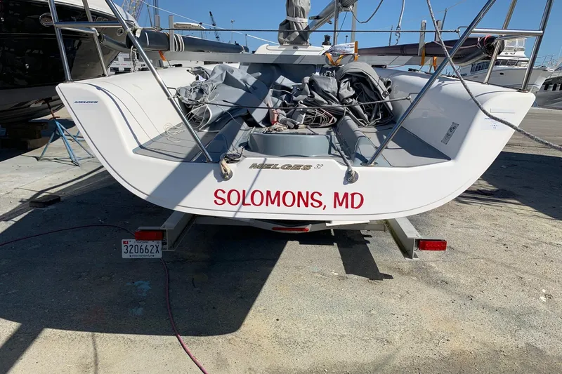 Slide: The Image of 2010 Melges 32 sailboat on trailer, Solomons, MD, docked at marina. - 8