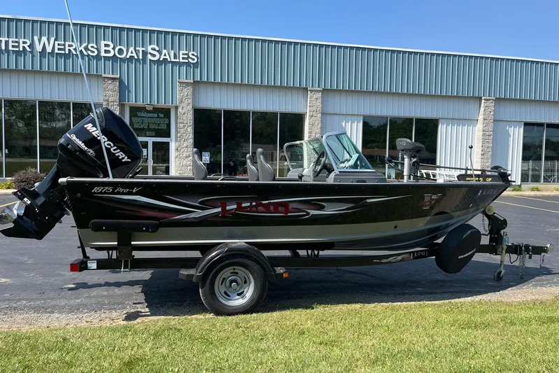 Slide: The Image of 2013 Lund 1875 Pro-V IFS boat with Mercury engine at dealership. - 0